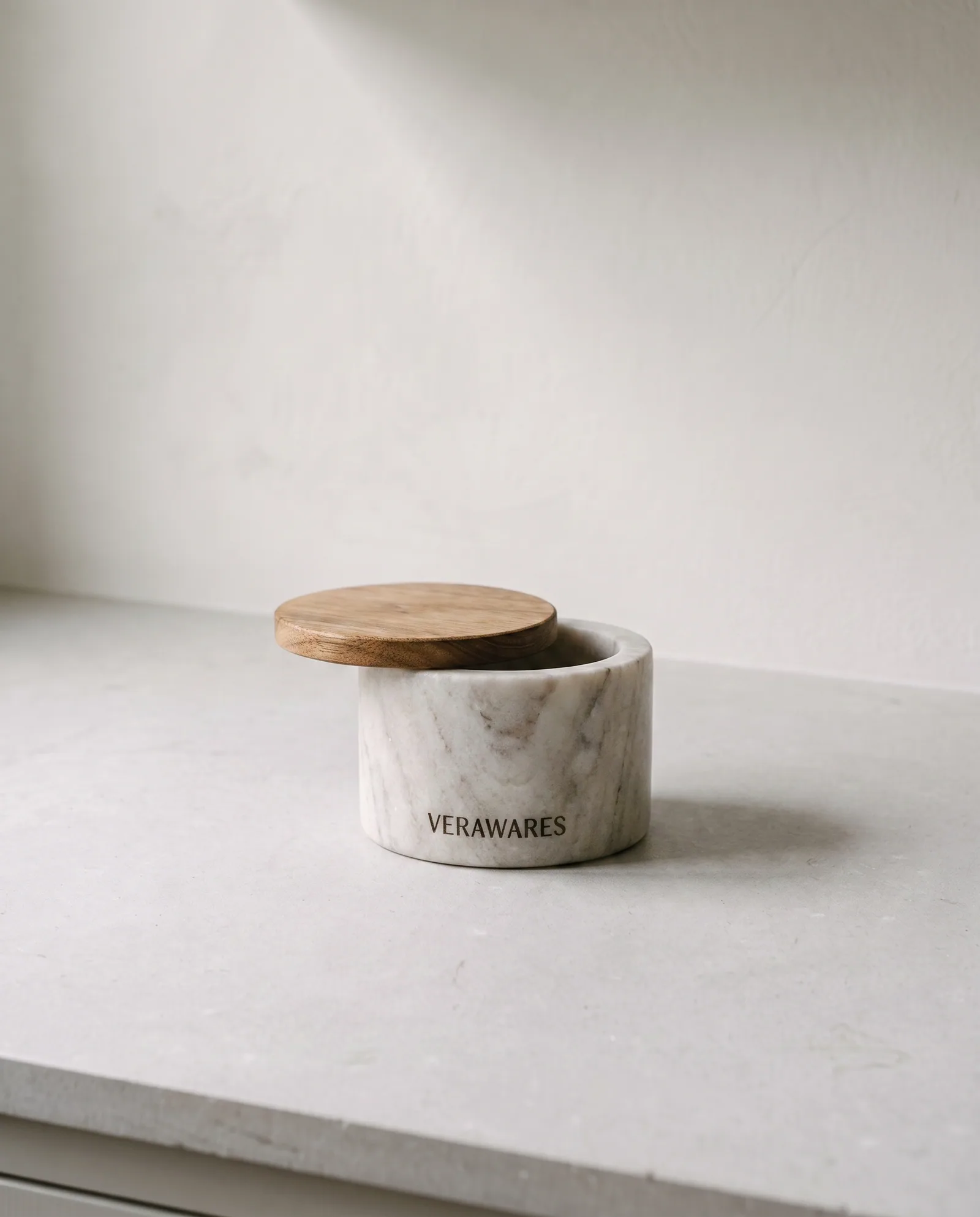 Salt Cellar — Honed marble cellar with a swivel lid