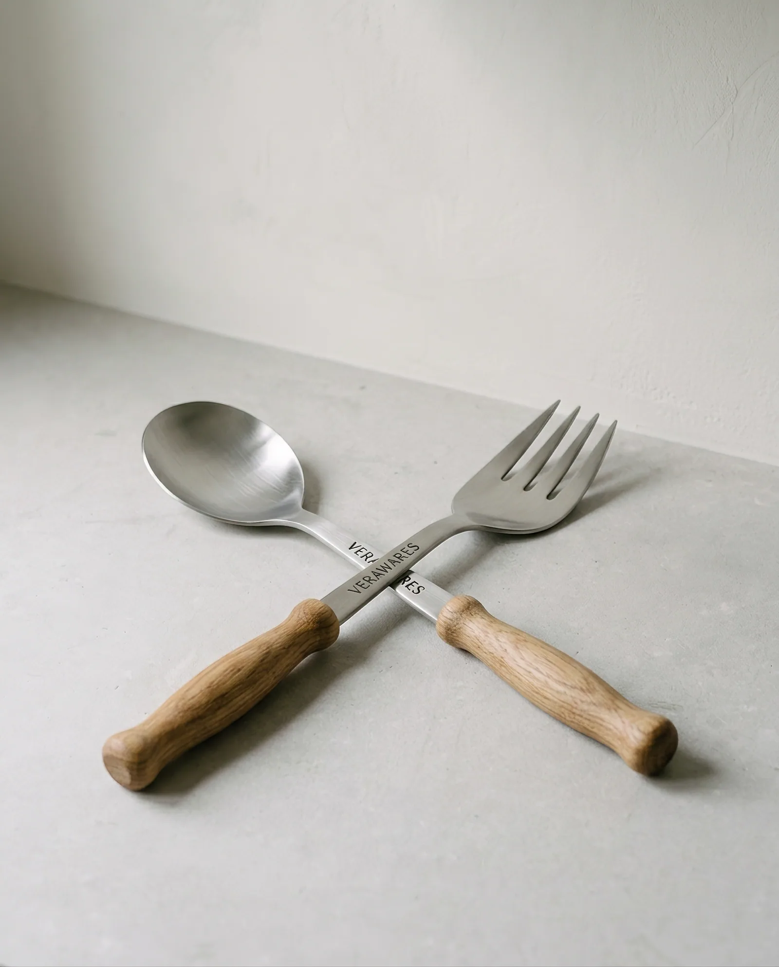 Serving Spoon & Fork — Matched stainless serving pair with oak handles